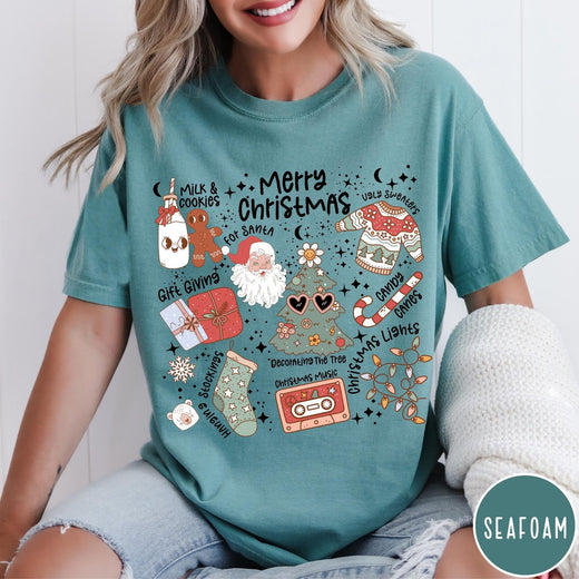 Comfort Colors tee in Seafoam featuring retro holiday graphic with Santa, Christmas tree, and festive icons