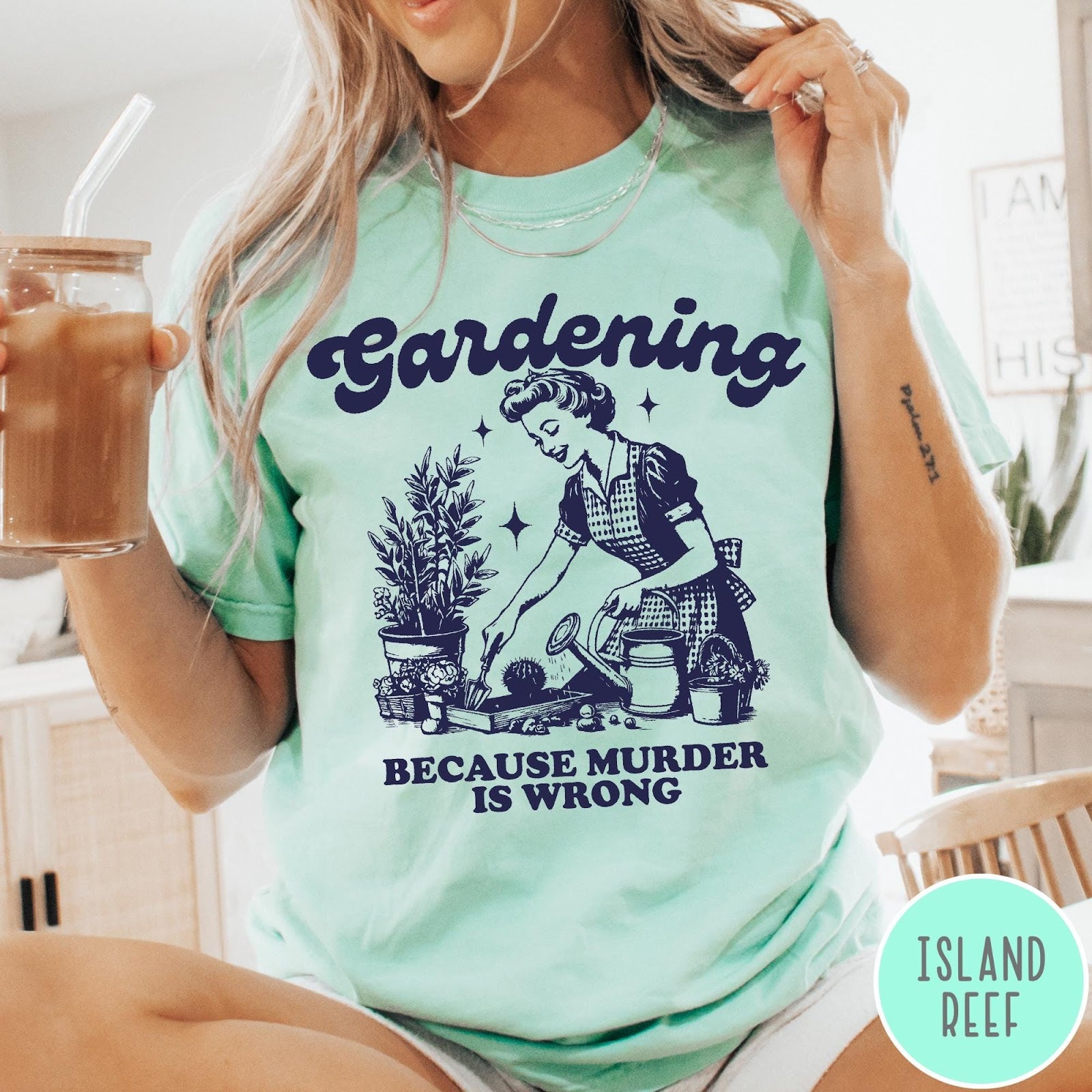 Comfort Colors tee in Island Reef featuring vintage style graphic of a woman gardening with text about murder.
