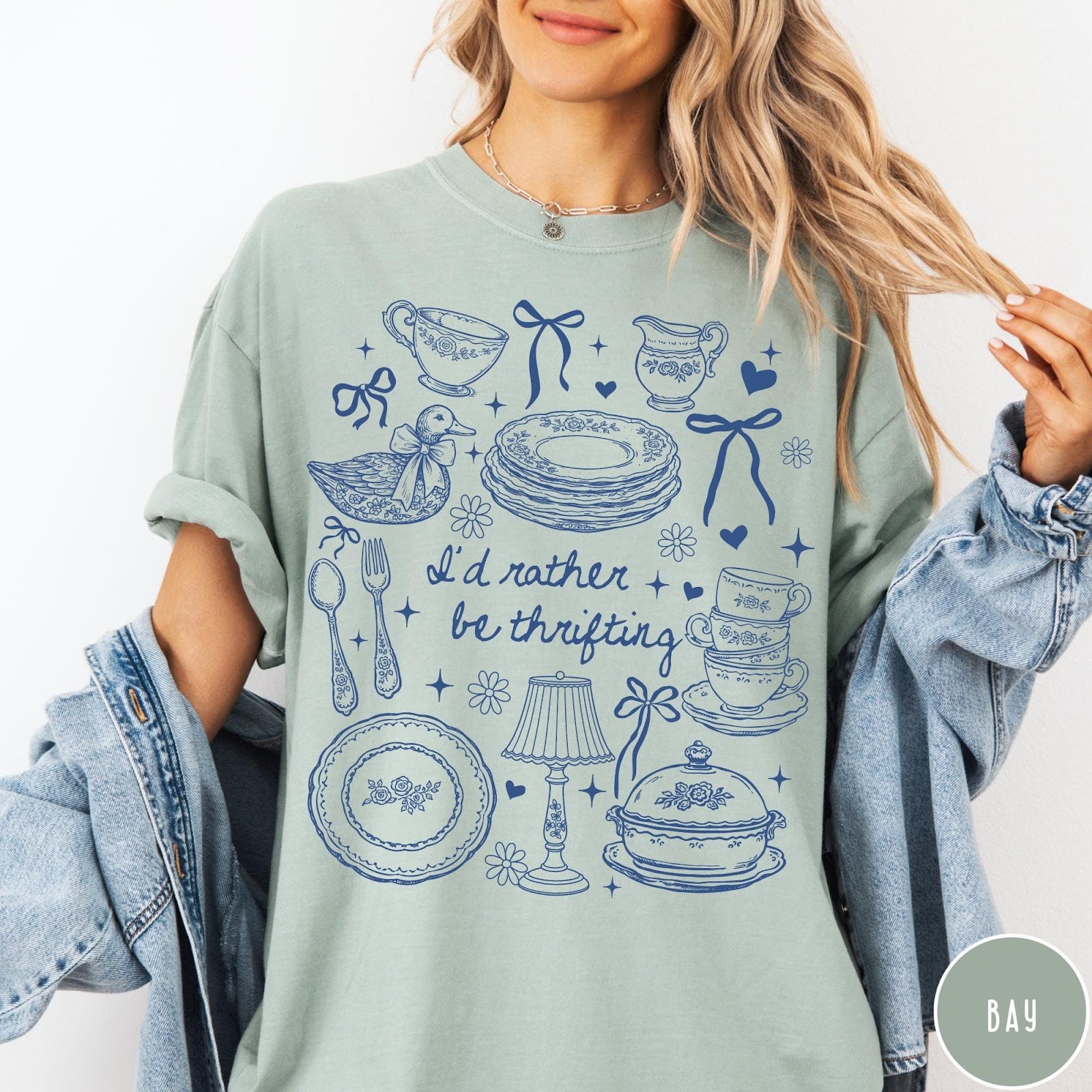 Comfort Colors tee in Bay featuring line art graphic of antique home goods and thrifting items