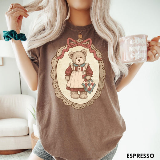 Comfort Colors tee in Espresso featuring vintage style teddy bear graphic inside a decorative lace oval frame