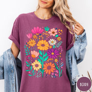 Comfort Colors tee in Berry featuring boho style floral graphic with vibrant orange, pink, and purple flowers