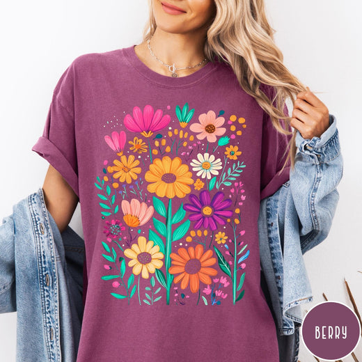 Comfort Colors tee in Berry featuring boho style floral graphic with vibrant orange, pink, and purple flowers