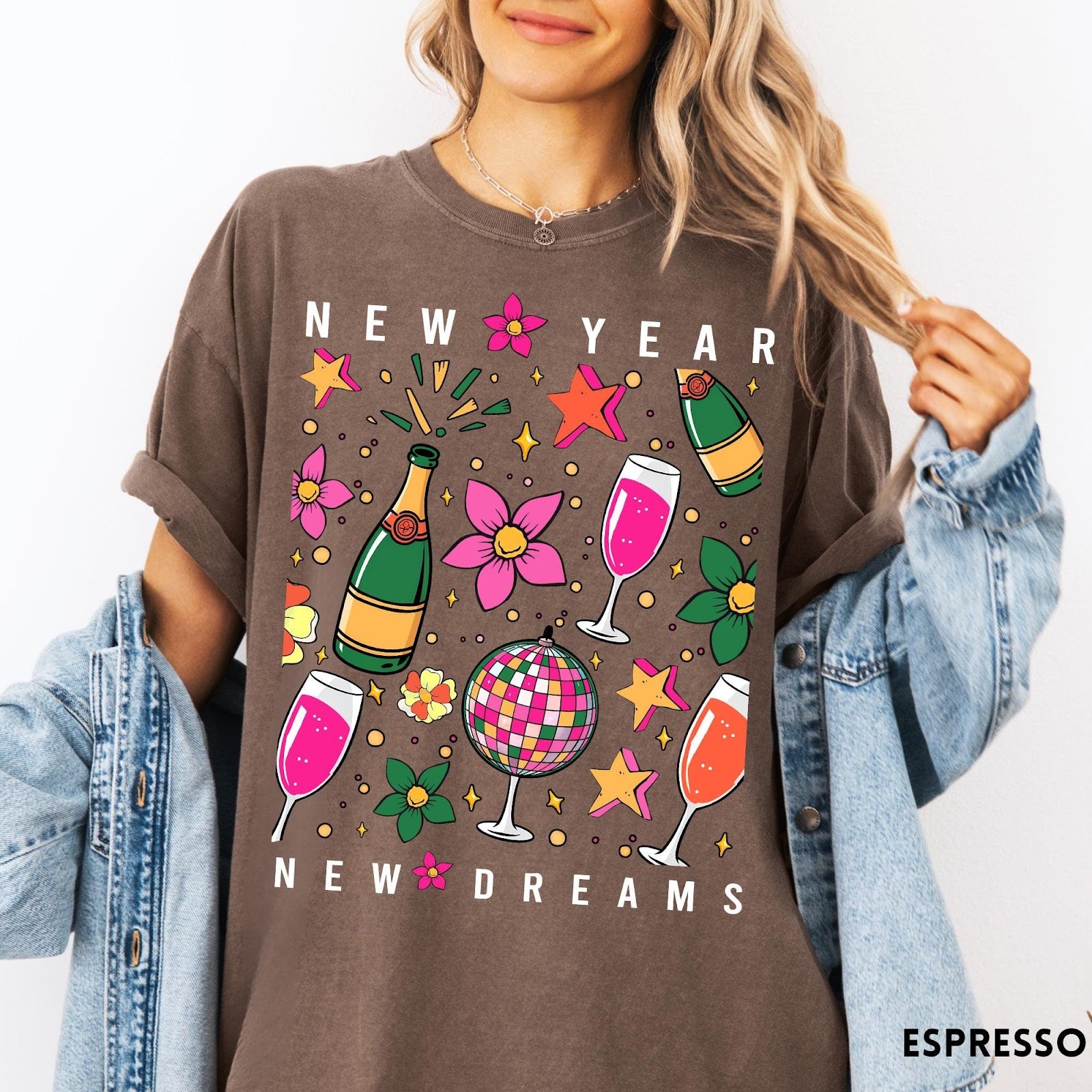 Comfort Colors tee in Espresso featuring New Year celebration graphic with champagne bottles, glasses, and disco ball