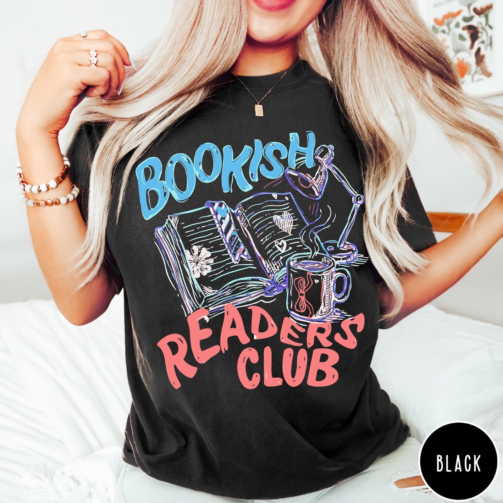 Comfort Colors tee in Black featuring bookish reading graphic with open book, lamp, and coffee mug