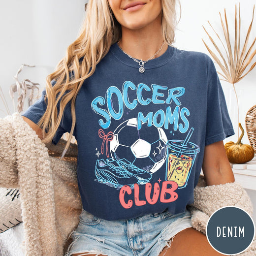 Comfort Colors tee in Denim featuring soccer mom lifestyle graphic with soccer ball, cleats, and iced coffee