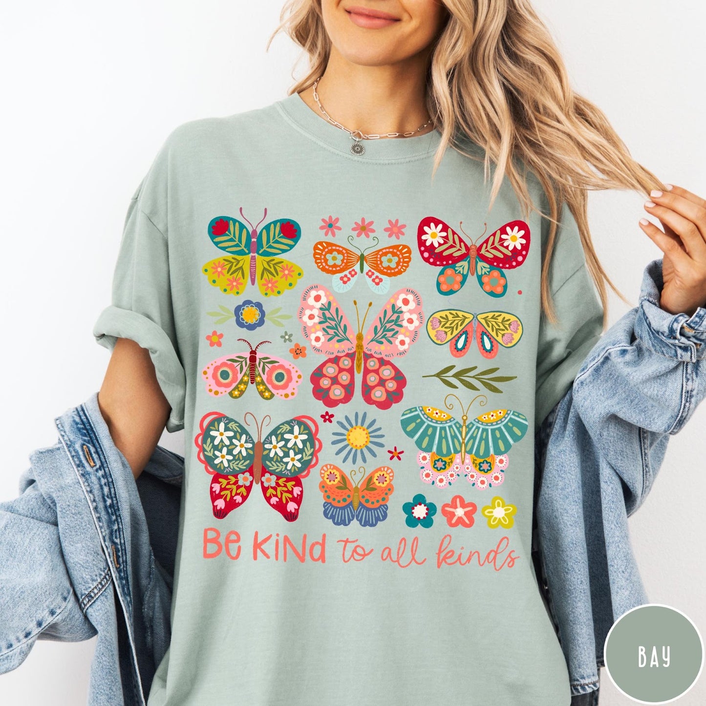 Comfort Colors tee in Bay featuring colorful butterfly and floral graphic with Be Kind to all kinds text