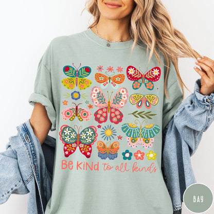 Comfort Colors tee in Bay featuring colorful butterfly and floral graphic with Be Kind to all kinds text