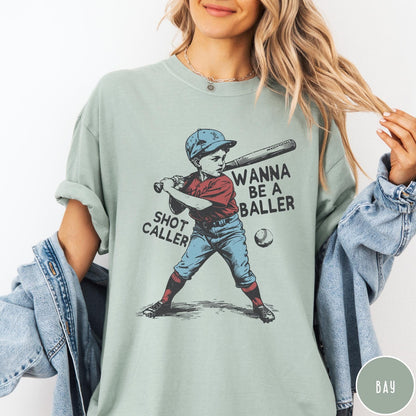 Comfort Colors tee in Bay featuring vintage style baseball player graphic with Wanna Be a Baller text