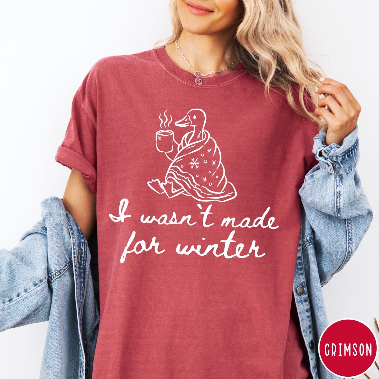 Comfort Colors tee in Crimson featuring line art graphic of a duck wrapped in a blanket drinking coffee