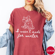 Comfort Colors tee in Crimson featuring line art graphic of a duck wrapped in a blanket drinking coffee