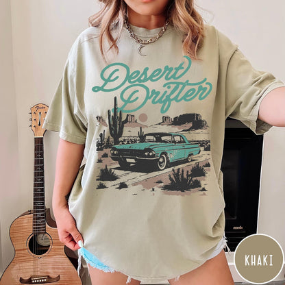 Comfort Colors tee in Khaki featuring vintage style graphic of a classic car in a desert landscape