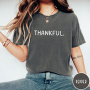 Comfort Colors tee in Pepper featuring minimalist design with the word Thankful printed in white text