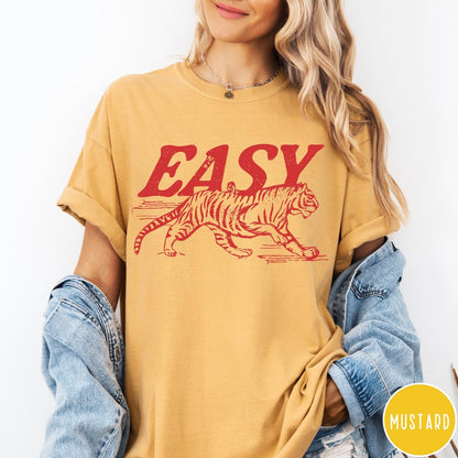Comfort Colors tee in Mustard featuring vintage style graphic of a walking tiger and text Easy
