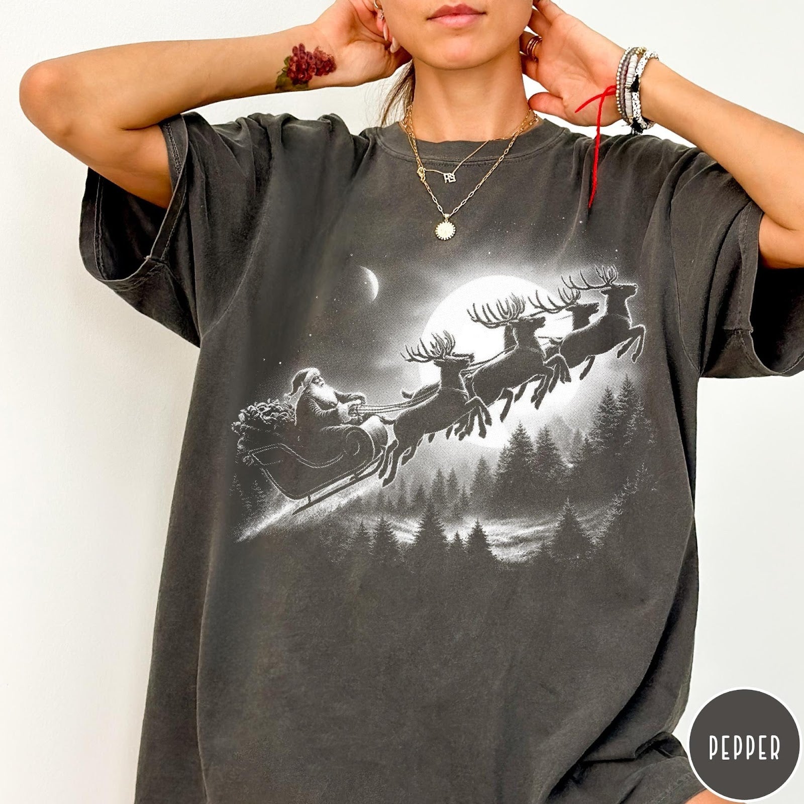 Comfort Colors tee in Pepper featuring vintage style Santa Claus flying in a sleigh with reindeer