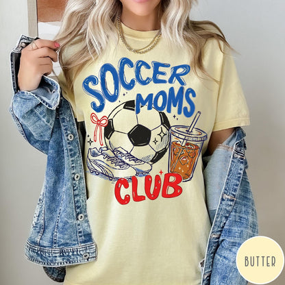 Comfort Colors tee in Butter featuring soccer mom lifestyle graphic with soccer ball, cleats, and iced coffee