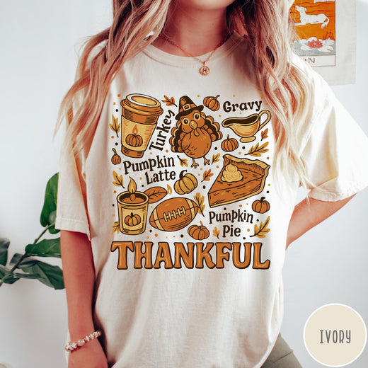 Comfort Colors tee in Ivory featuring retro Thanksgiving dinner items including turkey, pumpkin latte, and pumpkin pie graphic