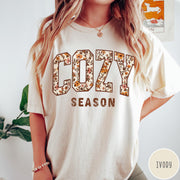 Comfort Colors tee in Ivory featuring autumnal floral typography with a cozy season graphic design