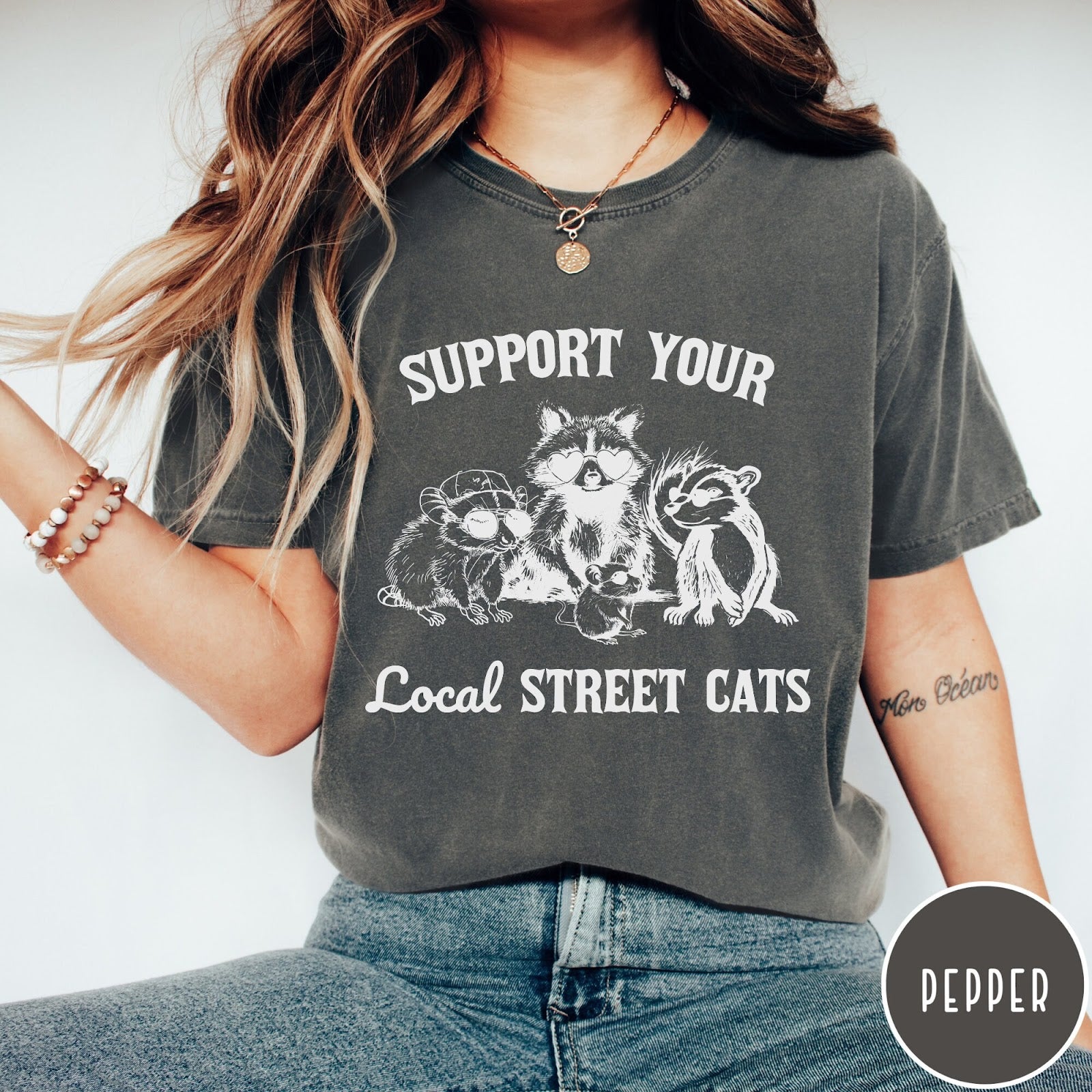 Comfort Colors tee in Pepper featuring illustration style graphic of a raccoon, opossum, and skunk wearing sunglasses