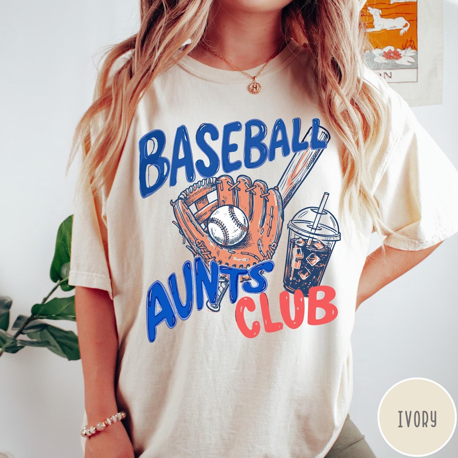 Comfort Colors tee in Ivory featuring baseball graphic with a mitt, ball, bat, and iced coffee drink