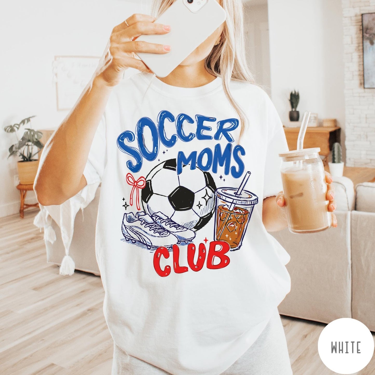 Comfort Colors tee in White featuring soccer mom lifestyle graphic with soccer ball, cleats, and iced coffee