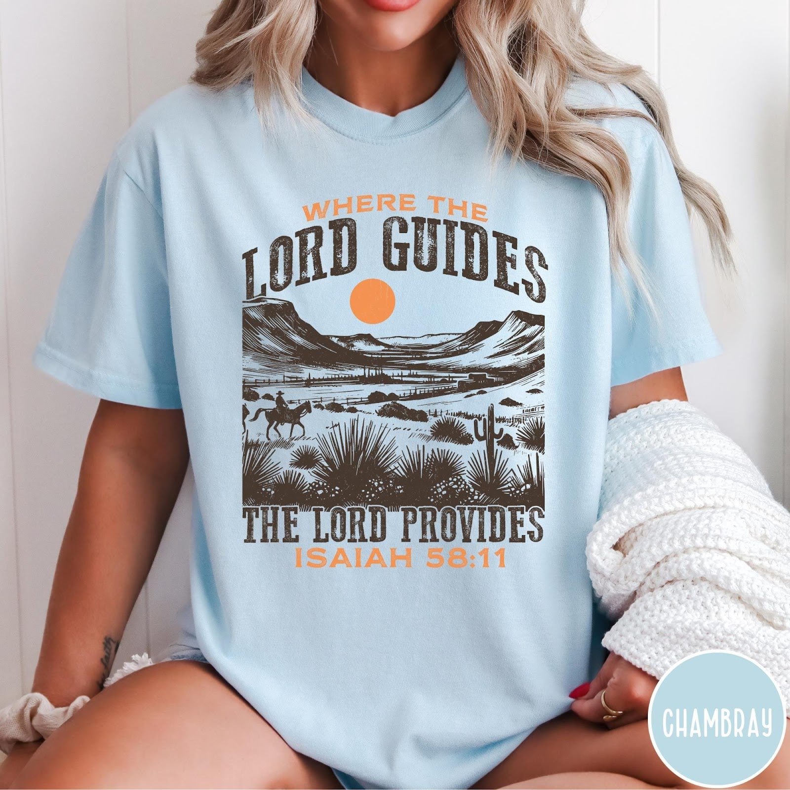 Comfort Colors tee in Chambray featuring desert landscape graphic with a rider and sun design.