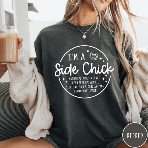 Comfort Colors tee in Pepper featuring circular Thanksgiving side dish graphic with turkey and food list