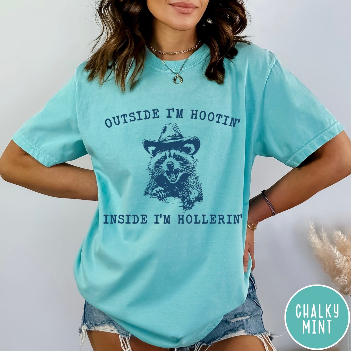Comfort Colors tee in Chalky Mint featuring western style graphic of a raccoon wearing a cowboy hat