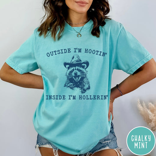Comfort Colors tee in Chalky Mint featuring western style graphic of a raccoon wearing a cowboy hat