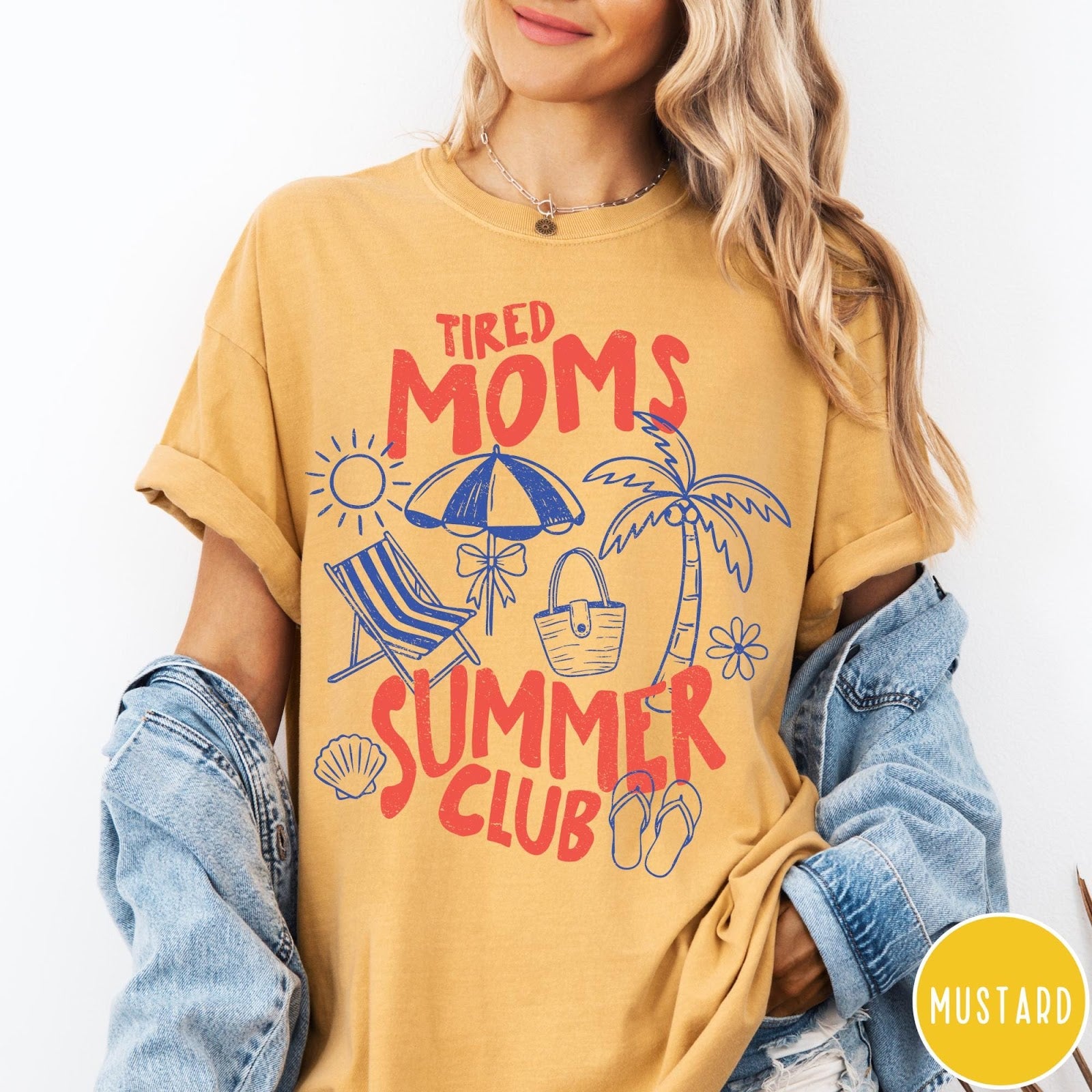 Comfort Colors tee in Mustard featuring beach vacation style graphic with sun, umbrella, palm tree, and bag