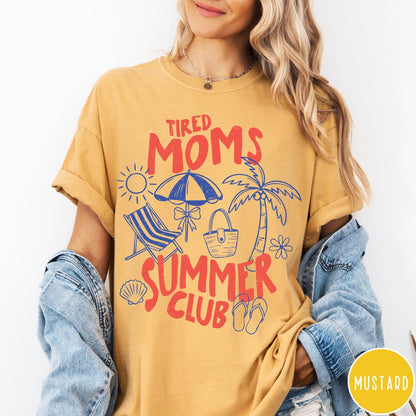 Comfort Colors tee in Mustard featuring beach vacation style graphic with sun, umbrella, palm tree, and bag