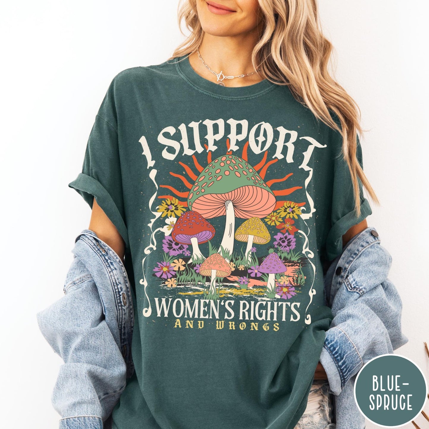 Comfort Colors tee in Blue Spruce featuring retro graphic design with colorful mushrooms, flowers, and sun illustration