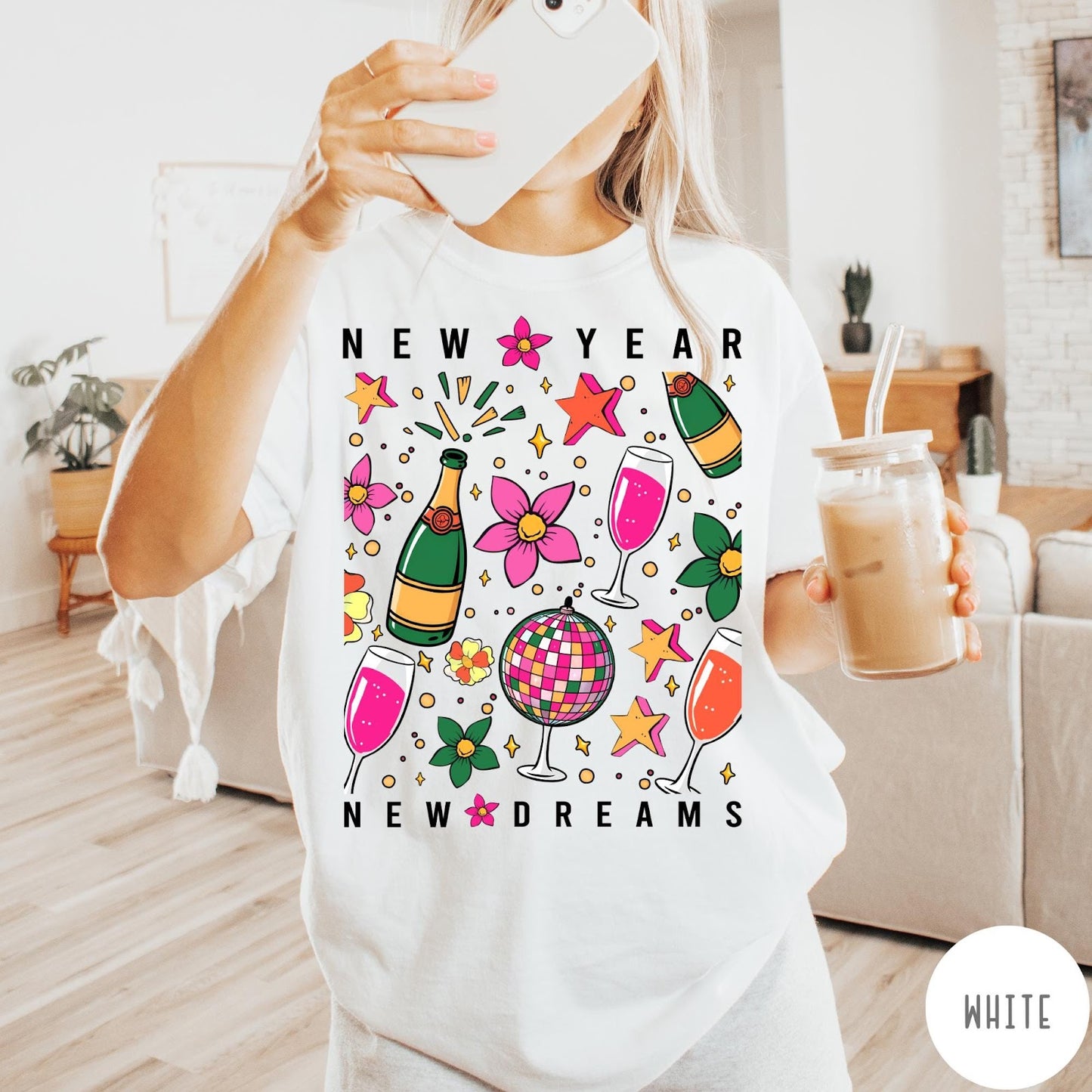 Comfort Colors tee in White featuring New Year celebration graphic with champagne bottles, glasses, and disco ball