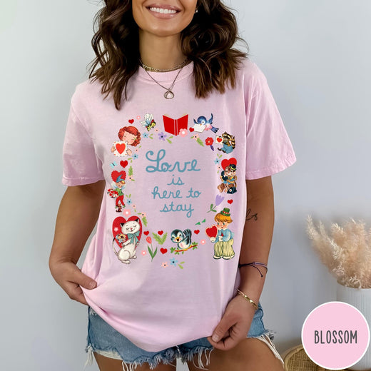 Comfort Colors tee in Blossom featuring vintage Valentine's collage with cute animals, flowers, and romantic text.