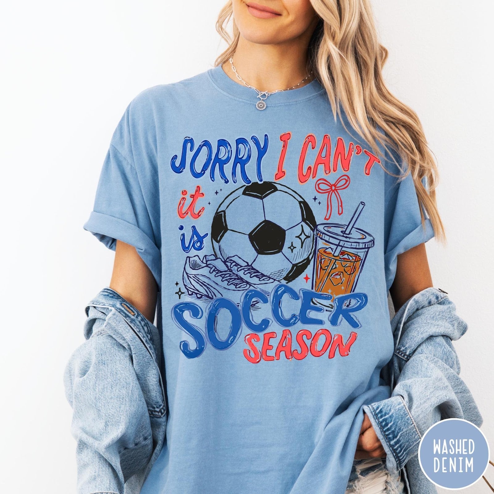 Comfort Colors tee in Washed Denim featuring soccer season graphic with soccer ball, cleats, and iced coffee