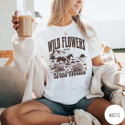 Comfort Colors tee in White featuring western style graphic of wild horses grazing in a wildflower field