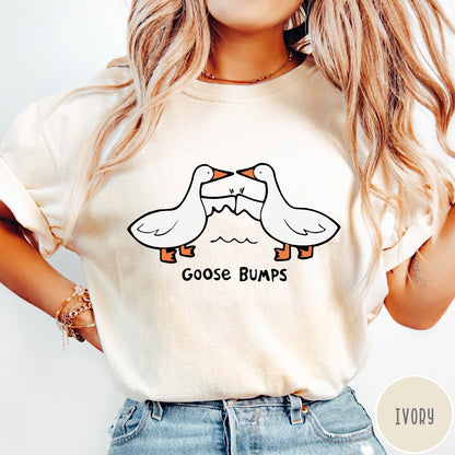 Comfort Colors tee in Ivory featuring cartoon style graphic of two geese giving each other a fist bump