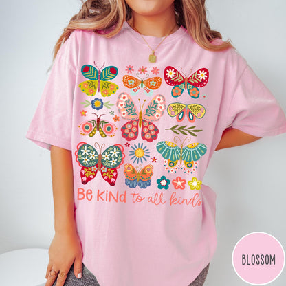 Comfort Colors tee in Blossom featuring butterfly and floral graphic design with Be Kind to all kinds text