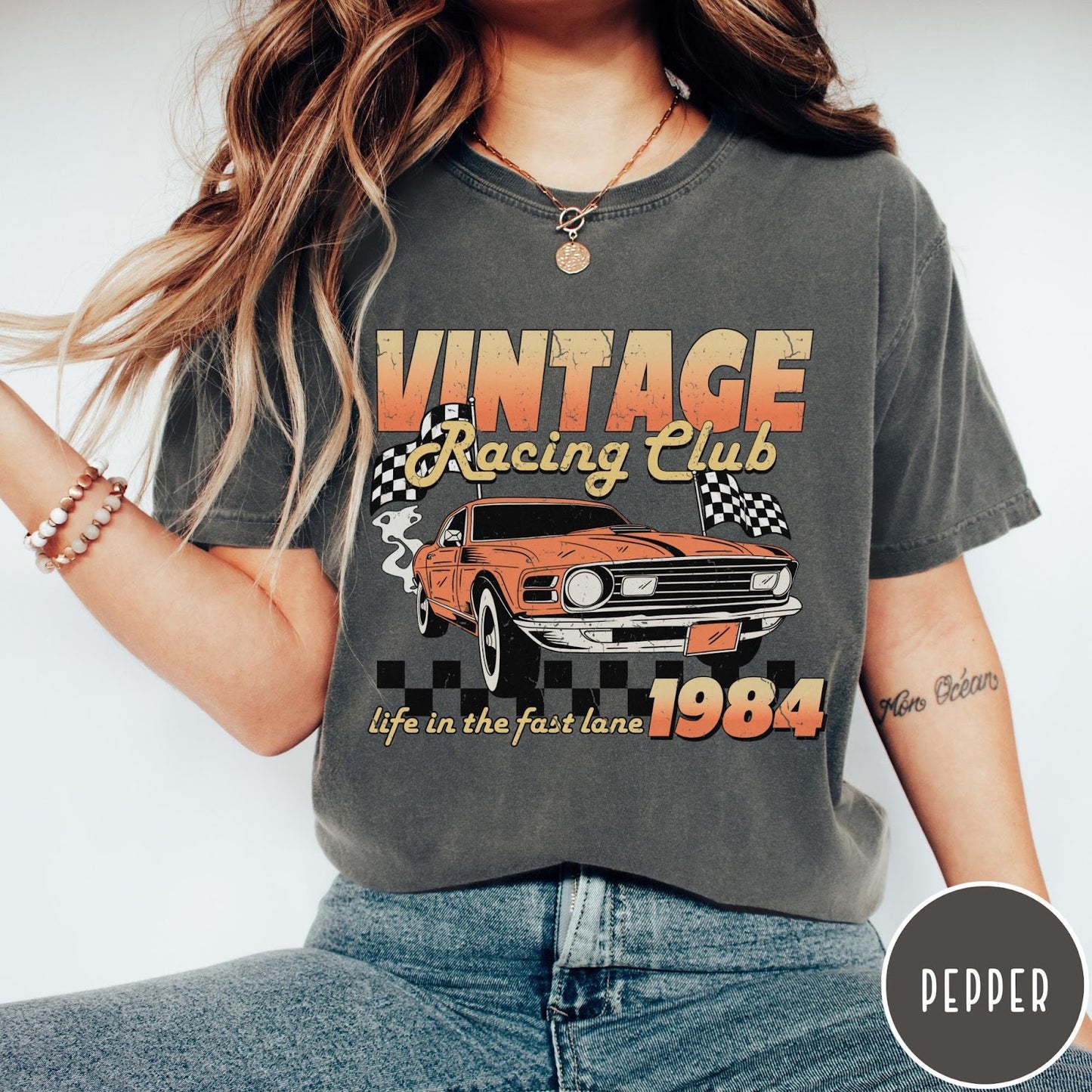 Comfort Colors tee in Pepper featuring vintage muscle car graphic with racing flags and 1984 text
