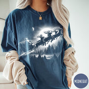 Comfort Colors tee in Midnight featuring vintage style Santa Claus flying in a sleigh with reindeer
