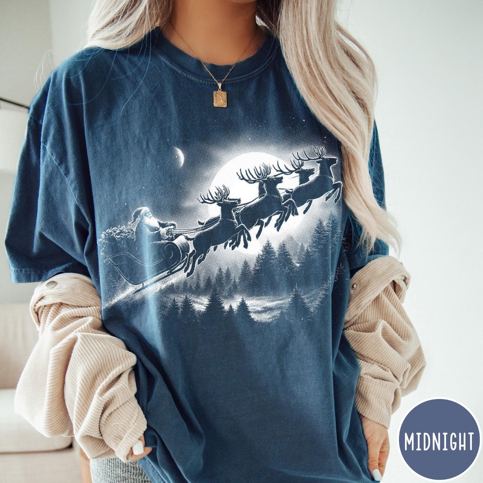 Comfort Colors tee in Midnight featuring vintage style Santa Claus flying in a sleigh with reindeer