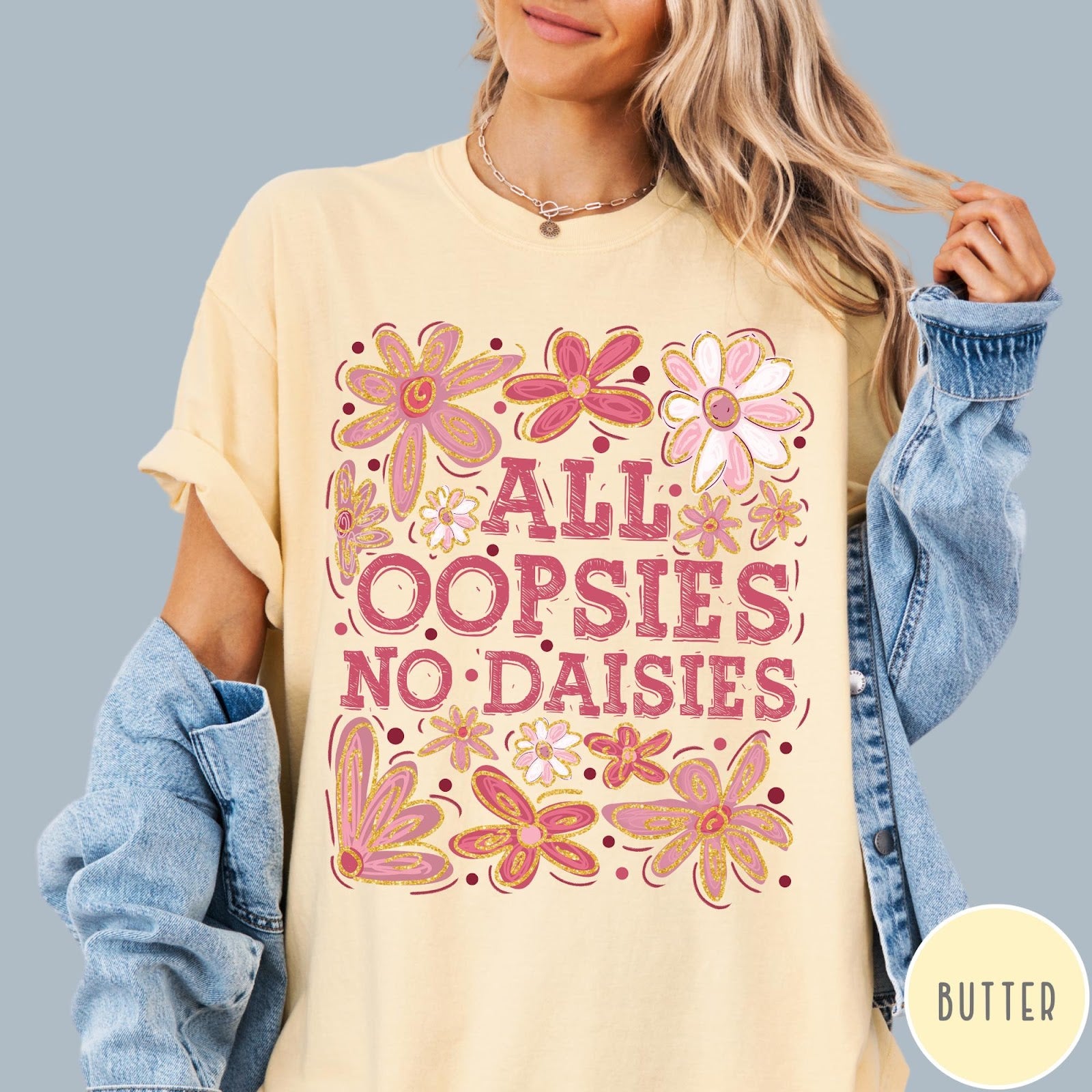 Comfort Colors tee in Butter featuring floral design with funny quote All Oopsies No Daisies text graphic