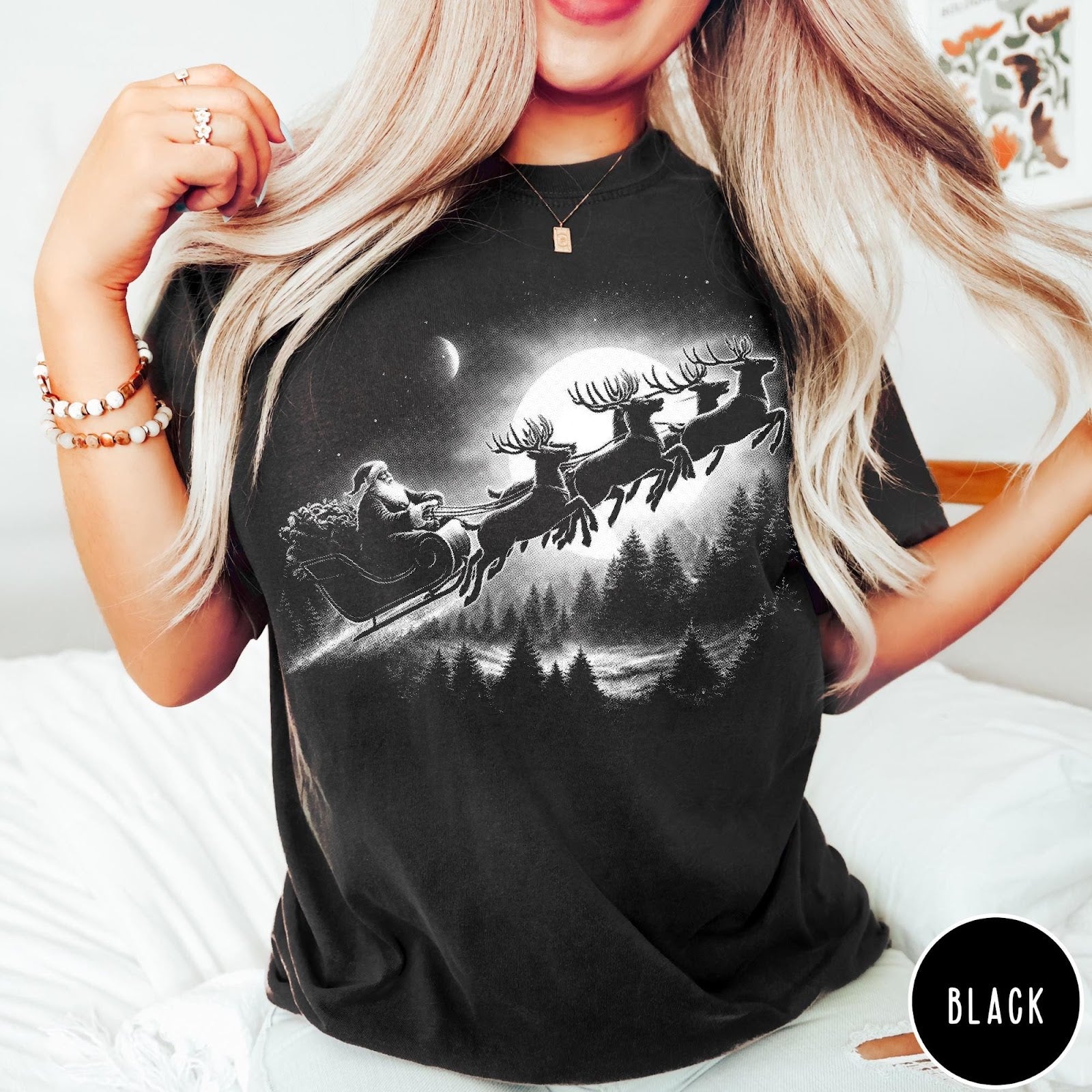 Comfort Colors tee in Black featuring vintage style Santa Claus flying in a sleigh with reindeer
