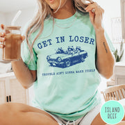 Comfort Colors tee in Island Reef featuring vintage style graphic of three raccoons driving a convertible car