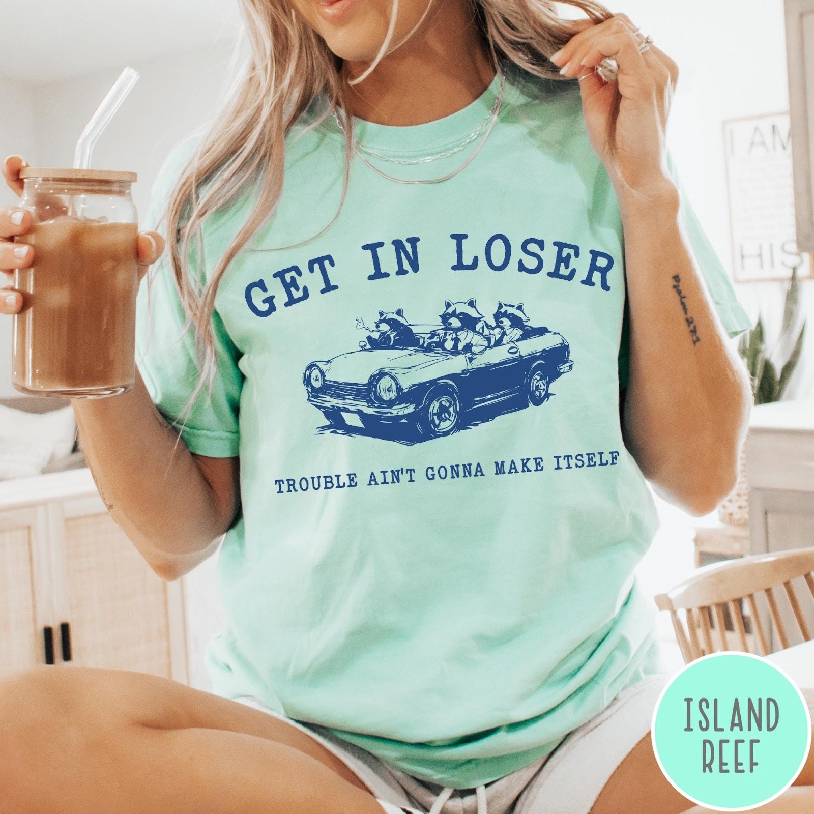 Comfort Colors tee in Island Reef featuring vintage style graphic of three raccoons driving a convertible car