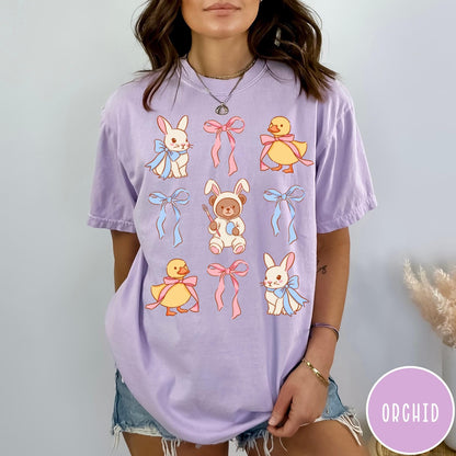 Comfort Colors tee in Orchid featuring vintage style graphic with Easter bunnies, ducks, and pink blue bows
