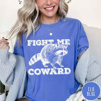 Comfort Colors tee in Flo Blue featuring screen printed raccoon graphic with Fight Me Coward text design
