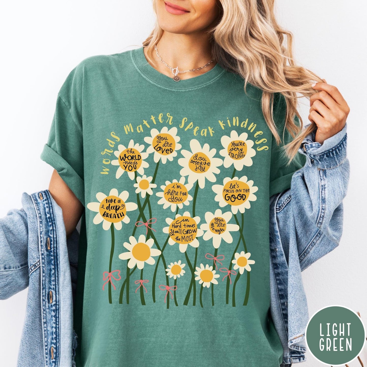Comfort Colors tee in Light Green featuring daisy graphic with positive affirmations and encouraging words about kindness