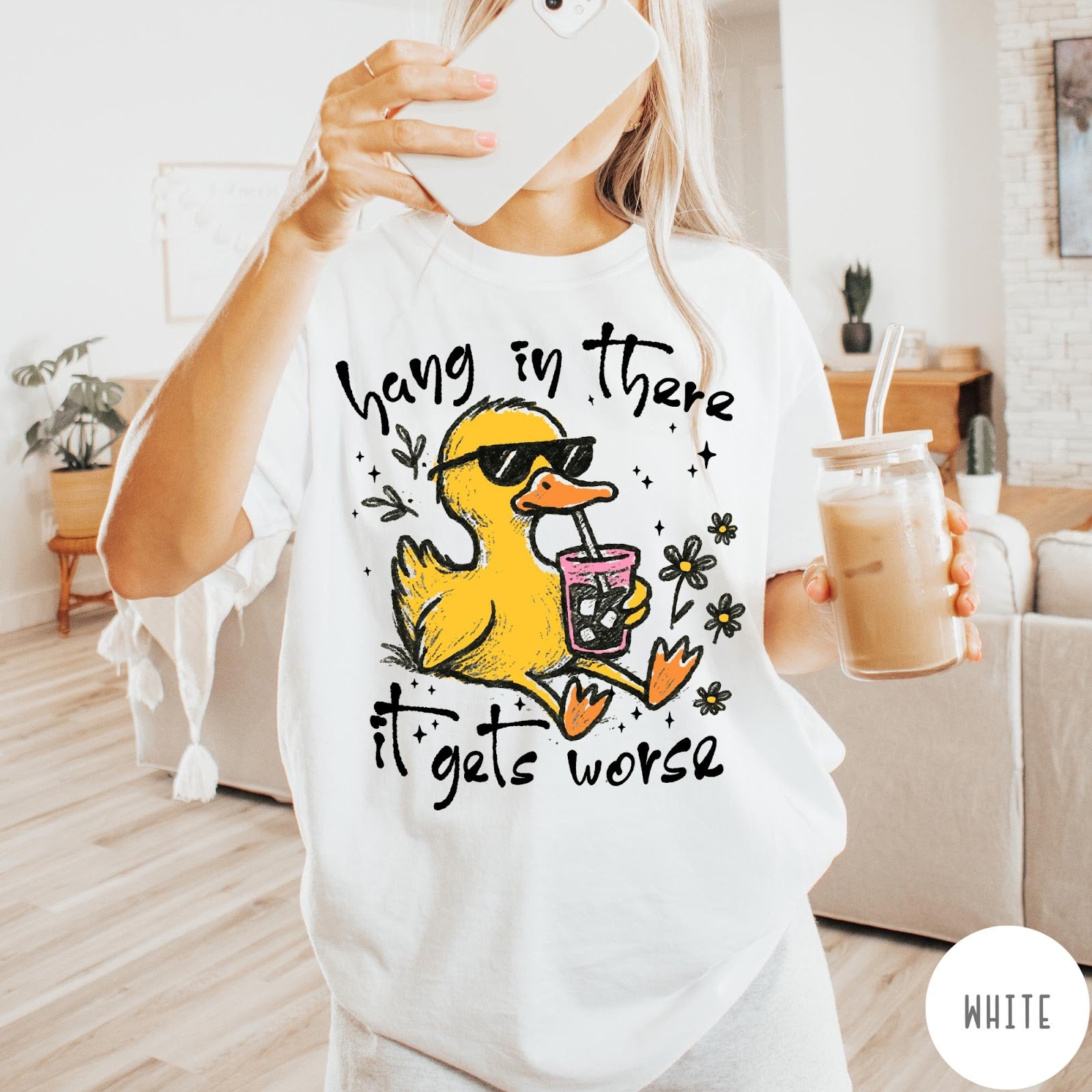Comfort Colors tee in White featuring illustrated duck graphic wearing sunglasses and drinking a pink iced beverage
