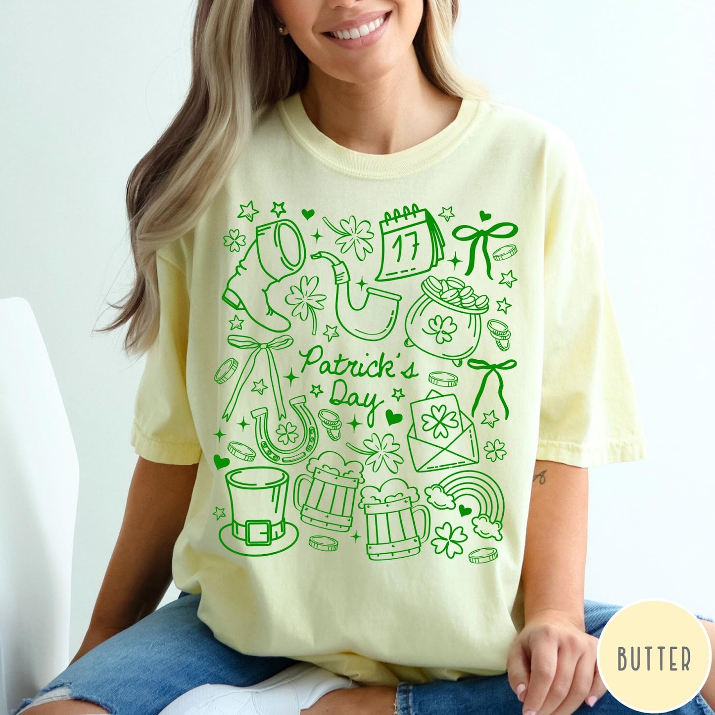 Comfort Colors tee in Butter featuring line art style St. Patrick's Day icons and symbols
