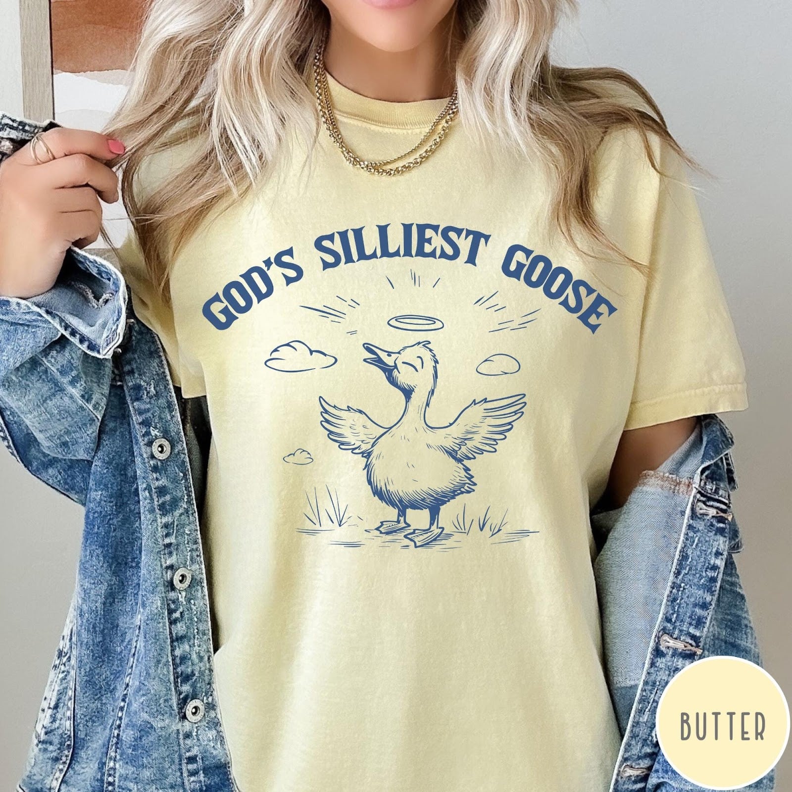 Comfort Colors tee in Butter featuring line art graphic of a goose with a halo and wings